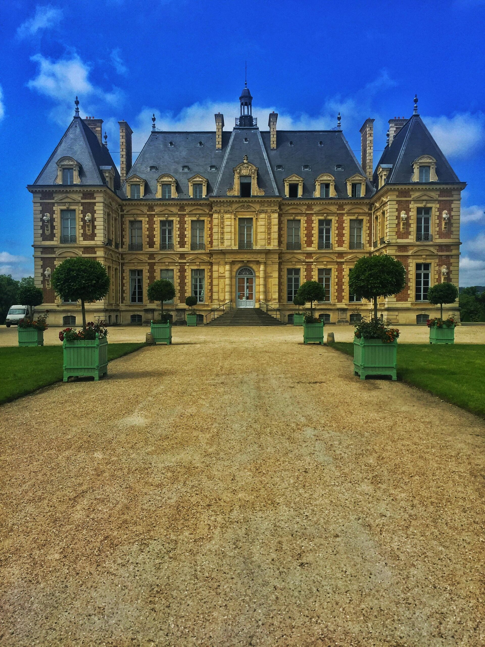 Elegant French château with manicured gardens and classic architecture in Antony, France.